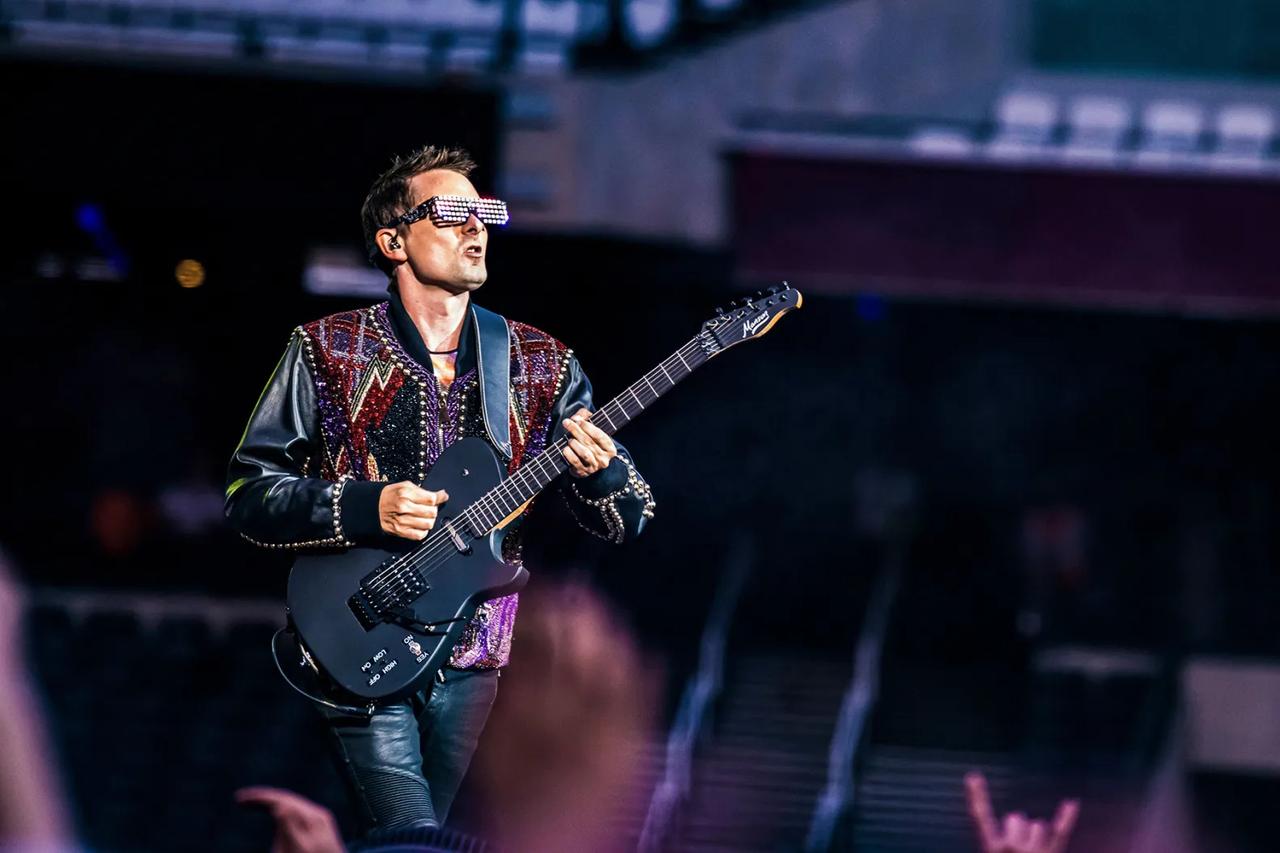 Muse’s Matt Bellamy smash guitar and gift to fan at London O2 show